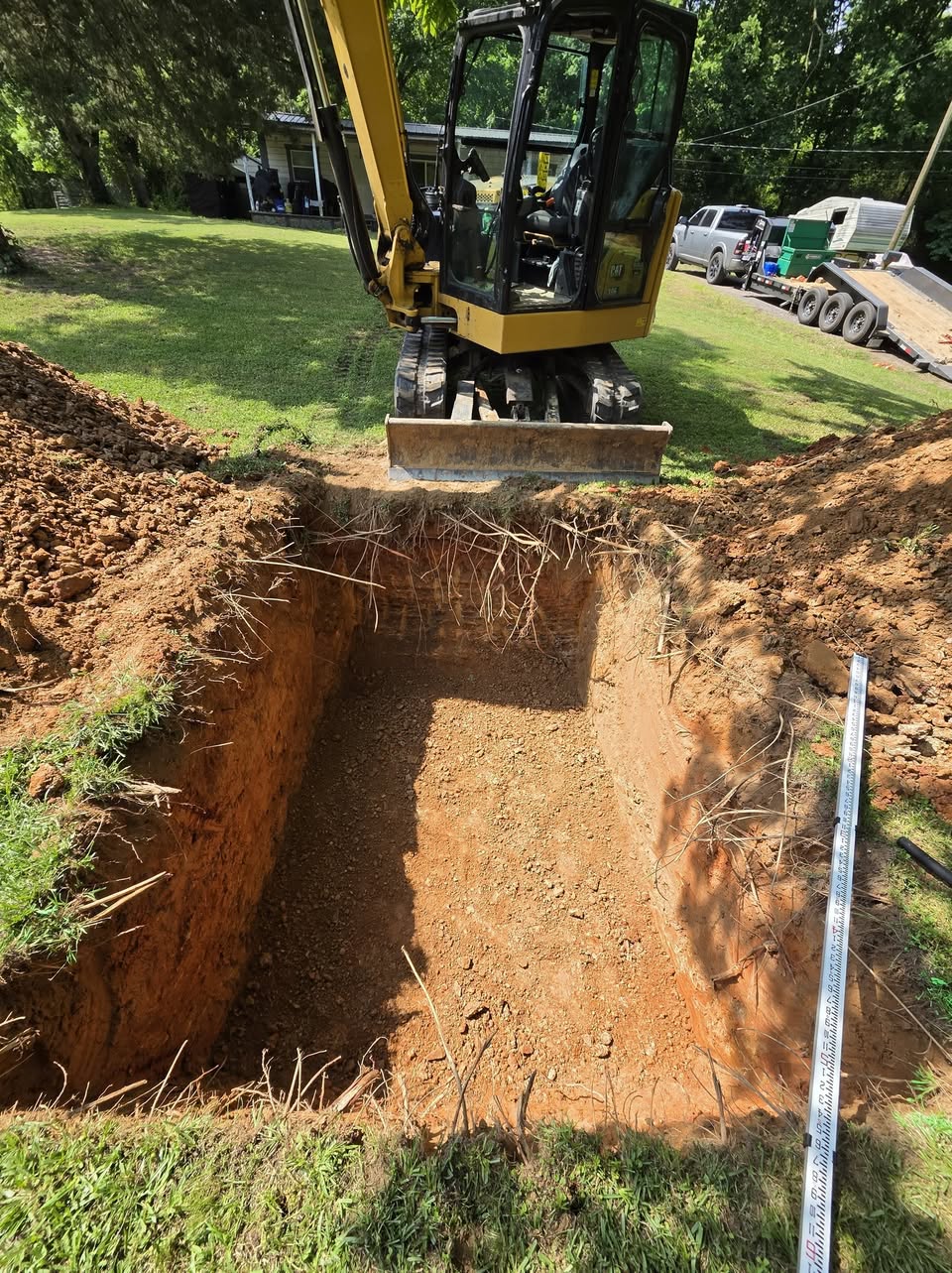 Excavation prepared for an in-ground storm shelter